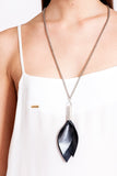 Black leather: made of hand-cut black leather, hand-cut and galvanized brass, quartz and galvanized metal components.