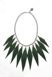 Wild child necklace in green / silver features leather spikes with galvanized brass and metal components.
