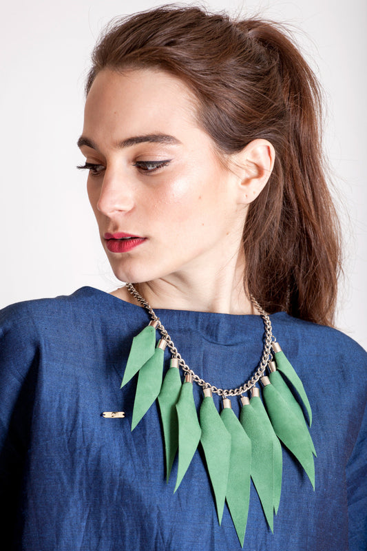 Wild child necklace in green / silver features leather spikes with galvanized brass and metal components.