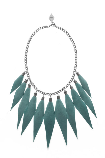 Wild child necklace in turquoise / silver features leather spikes with galvanized brass and metal components.