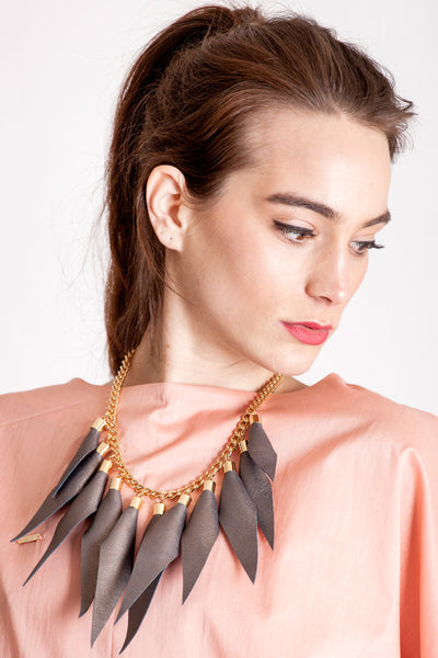 Wild child necklace in copper brown / gold features leather spikes with galvanized brass and metal components.