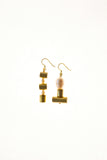 This mismatched earrings are made of hand cut and 24K gold-plated brass, freshwater pearls and gold-plated sterling silver.