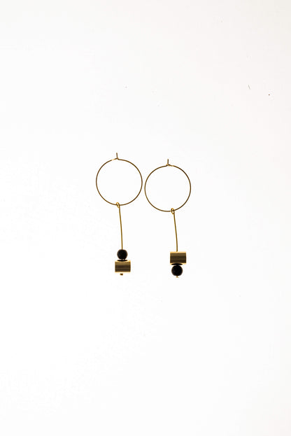 This pair of earring is made of a hoop earring which features 24K gold-plated brass and detachable pendant made of 24K gold-plated brass and onyx.