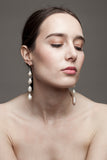 Elegant earrings made of sterling silver and baroque freshwater pearls.