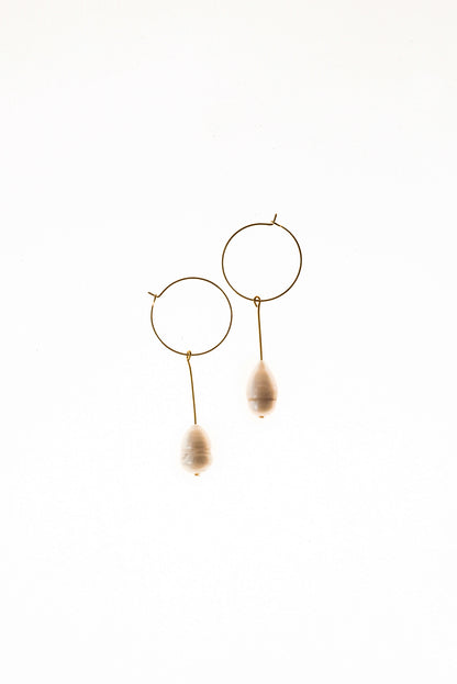 Earrings made of 24K gold plated brass and freshwater pearl.