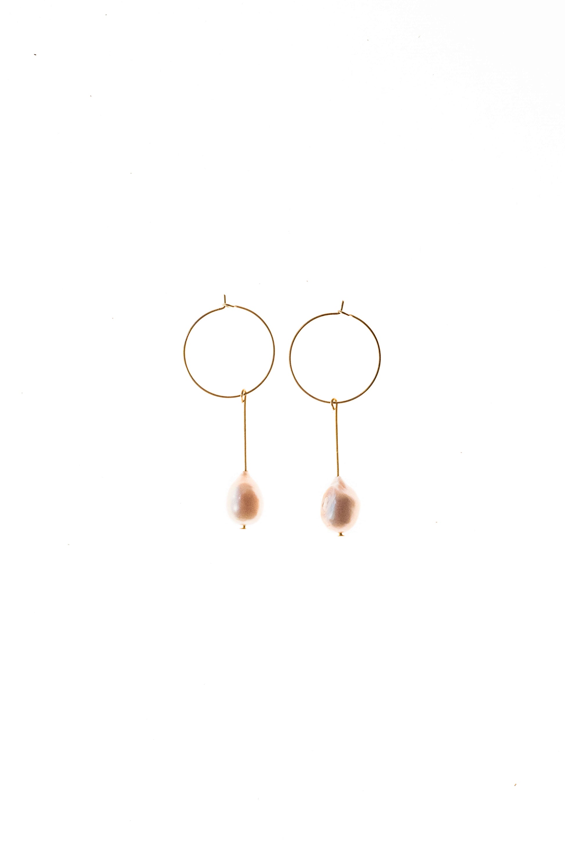 Earrings made of 24K gold plated brass and pink freshwater pearl.