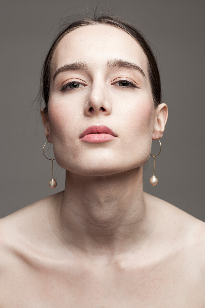 Earrings made of 24K gold plated brass and pink freshwater pearl.