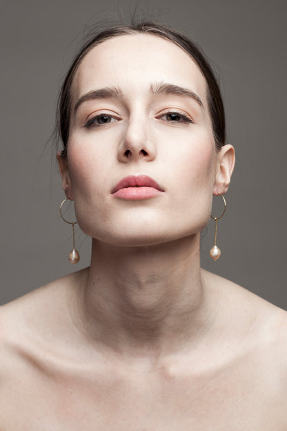 Earrings made of 24K gold plated brass and pink freshwater pearl.