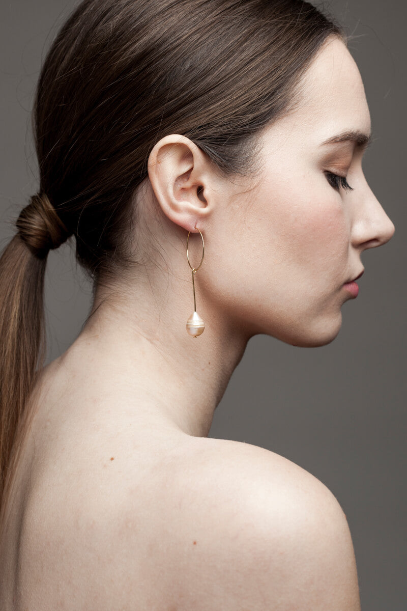 Earrings made of 24K gold plated brass and pink freshwater pearl.