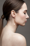Earrings made of 24K gold plated brass and pink freshwater pearl.