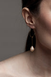 Earrings made of 24K gold plated brass and pink freshwater pearl.