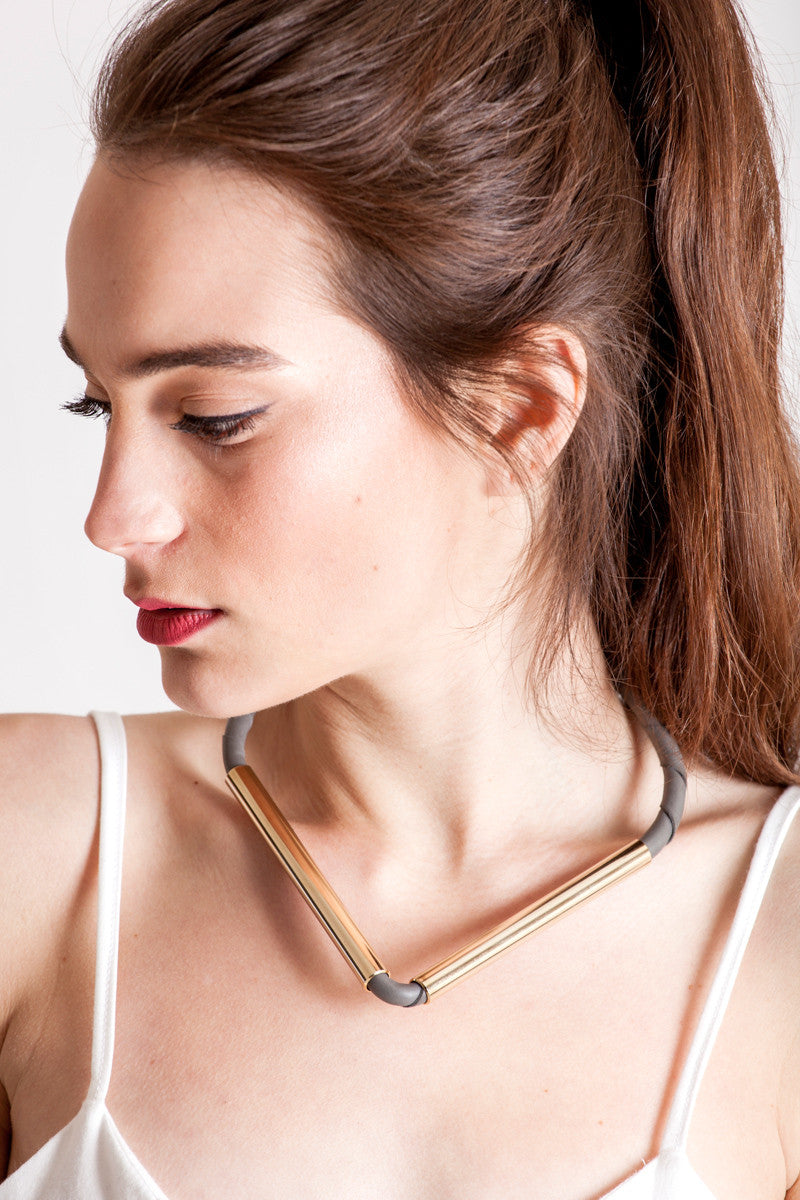 Triangle necklace made of finest gray leather and hand-cut, hand-polished and galvanized brass.